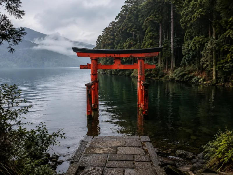 The vermilion torii of Hakone Shrine standing in Lake Ashi at Motohakone